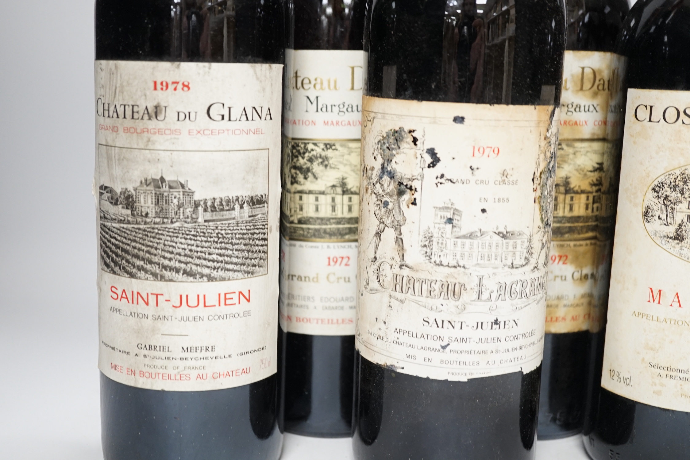 Three bottles of Chateau Dauzac Margaux 1972 and three other bottles Chateau Du Glana Saint Julien 1978, Chateau Lagrange Saint Julien 1979 and Clos Bellevue Margaux 1987